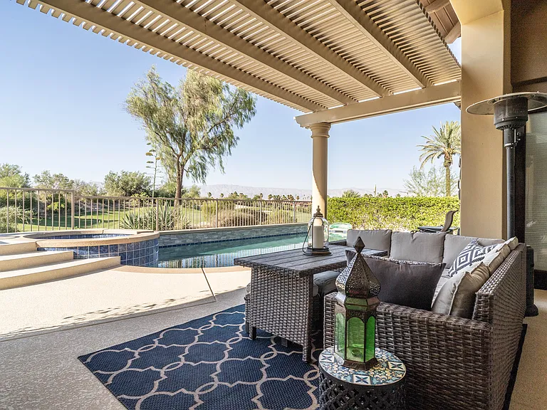 There is also a firepit for winter nights that can be swapped out for this dining table.