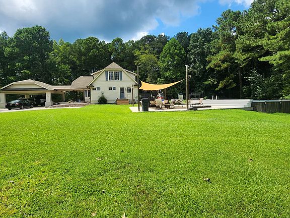 Full property views highlight the spacious land and side entrance to the home_offering plenty of room to enjoy the outdoors, relax, or entertain in a private setting.