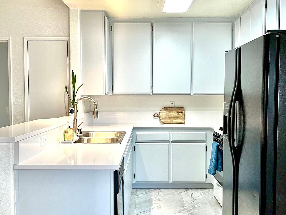 Kitchen with new quartz counter top and flooring