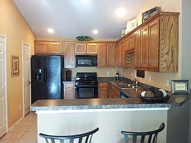 Bar-seating, pantry, and separate utility room access.