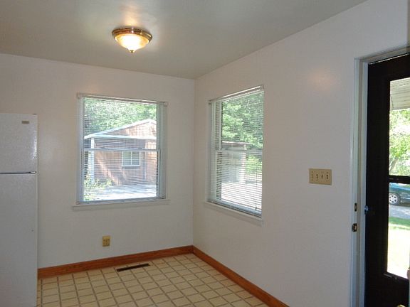 Enter into the kitchen/dining area from the side door. Great for bringing in the groceries! There is a brand new door and screen door.