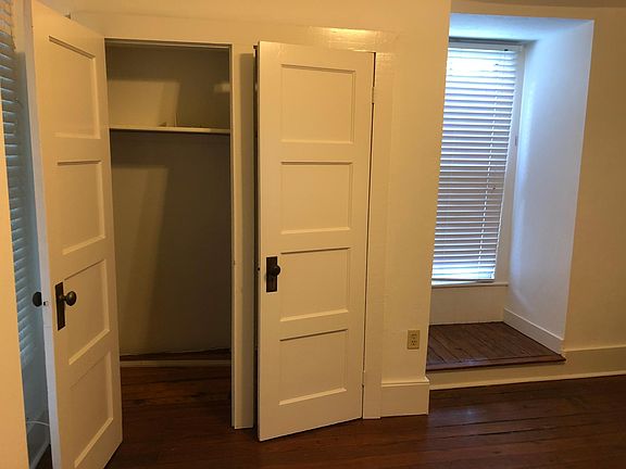 Another view of the kitchen/den showing pantry/storage.