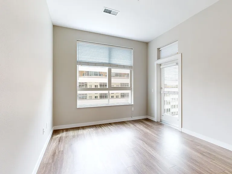 Apartment living room with wood-style flooring.