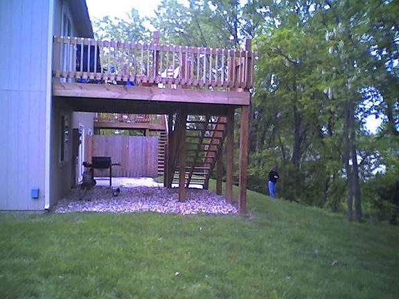 Backyard (2902 beyond wood fence.) Both units have deck and patio and fenced dog runs (not shown in this photo)