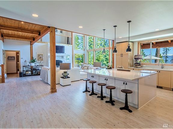 The removal of a wall between the entry and the kitchen allowed for the ultimate open concept floor plan, beckoning togetherness from the moment you walk in the front door. 