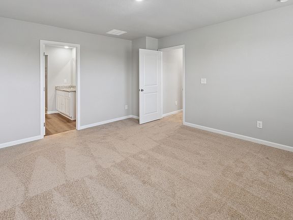 The master suite has a large bedroom, private bathroom and great, walk-in closet.