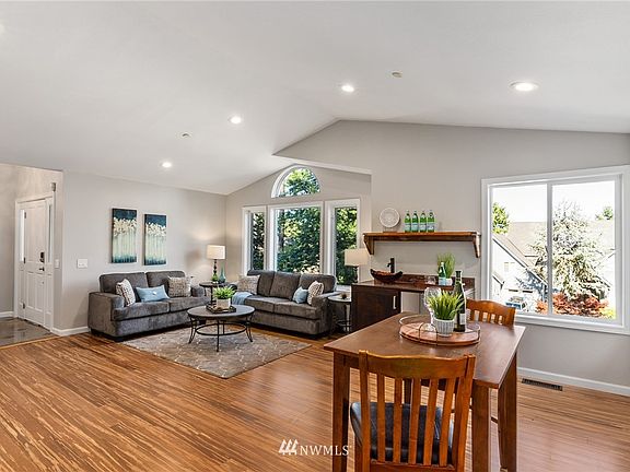 Entertainer's dream: Plenty of room for cozy conversation space on the couches, playing a game at the table, or enjoying the wet bar! 