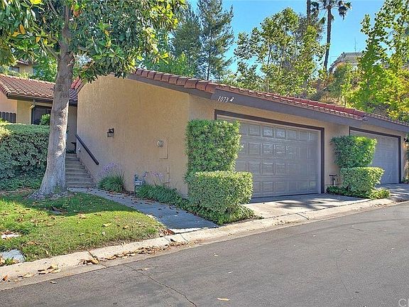 Lovely entrance with lots of grassy areas.