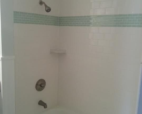 Hallway bathroom with subway tile.