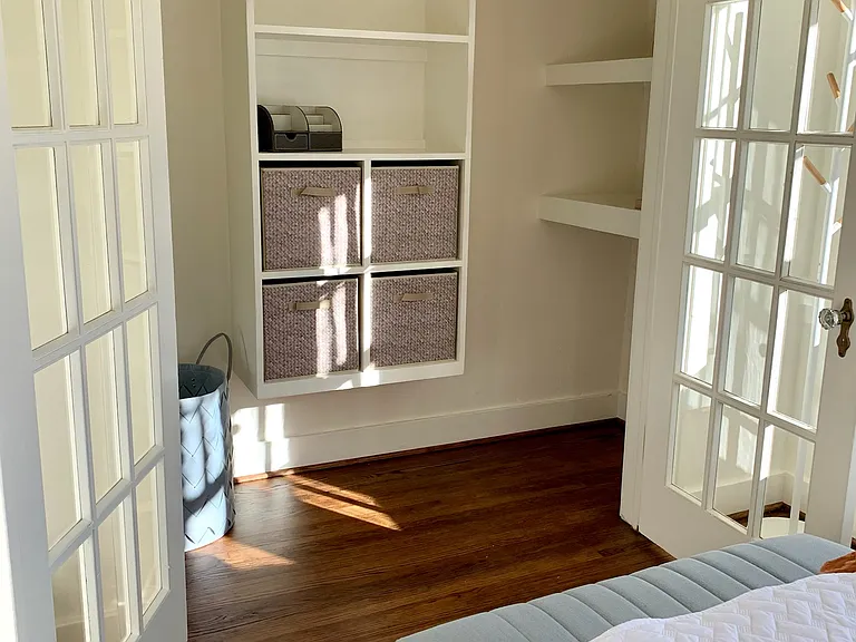 Large closet space with built in shelving.