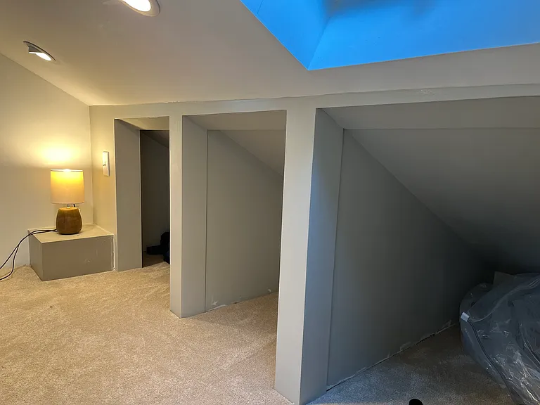 Three ample loft storage cubbies.
