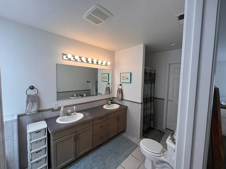 Master bath with 2 sink vanity, separate shower and soaking tub