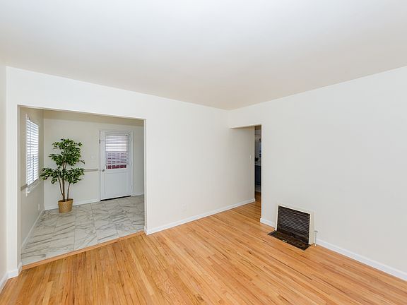 Living room with resanded and revarnished original wood floors.