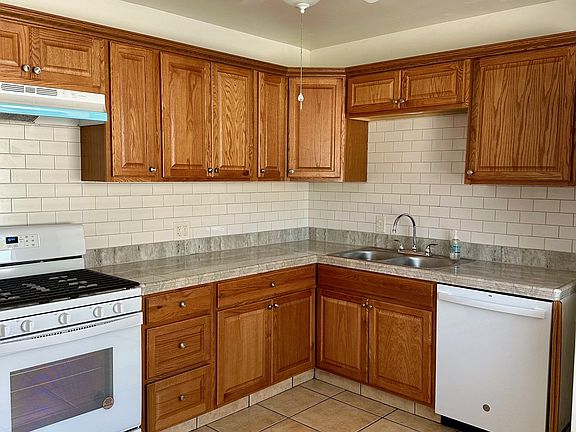 new kitchen, new stove, new ceiling fan, dishwasher and oven fan