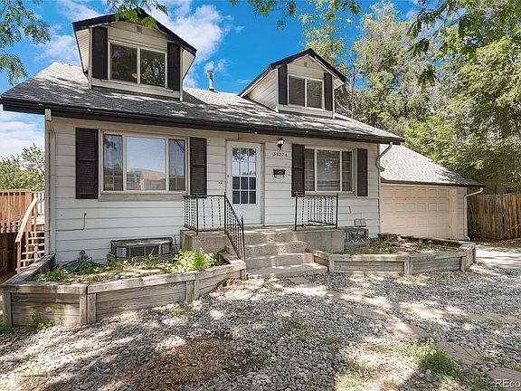 View of the front of the home, it's a nice blue now. Deck is of the kitchen giving access to the front yard.