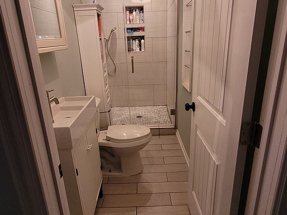 Renovated Master Bathroom, huge shower with Rain Shower fixture overhead.