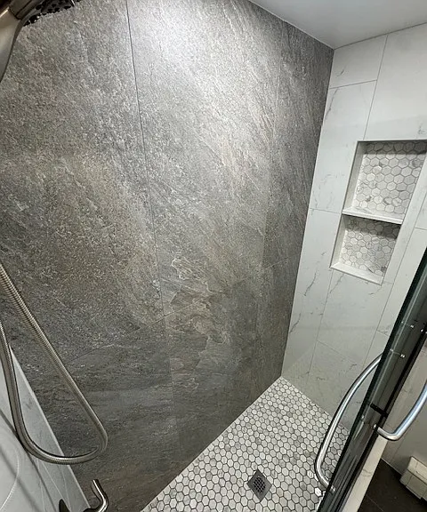 Another angle of shower with niche for storage