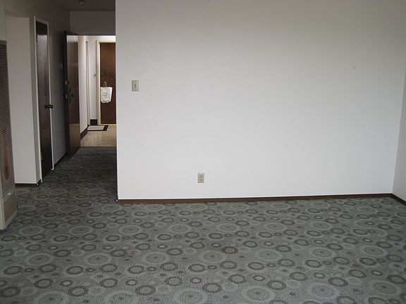 Large space with wall to wall carpeting throughout