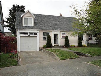 Charming renovated home with open floor plan and spiral stairs.