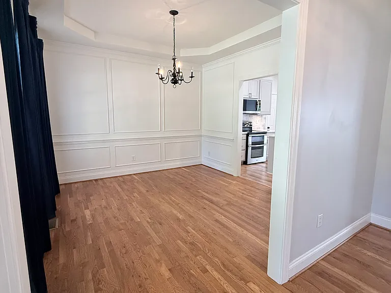 The formal dining room is located to the left of entry foyer
