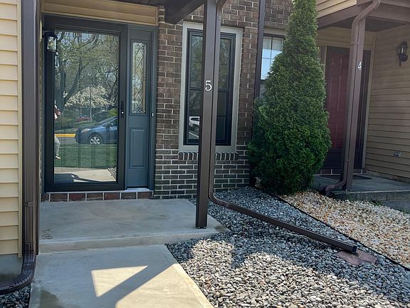 Front entry, new landscaping and concrete entry