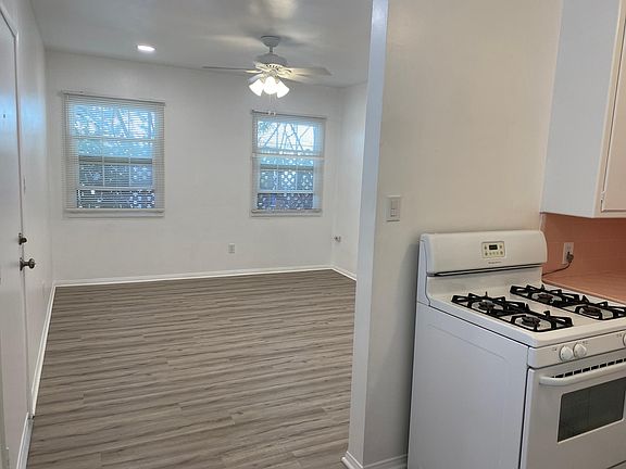 View from kitchen to the living room with entry door on the left.
