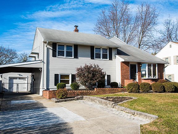front view of house, double-wide driveway section