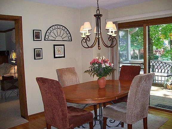 Breakfast nook overlooks deck adn the water