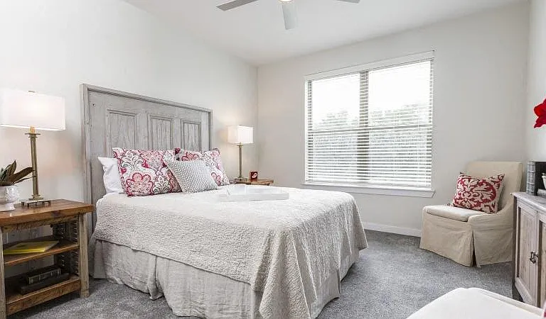 Furnished model bedroom with 9ft ceilings