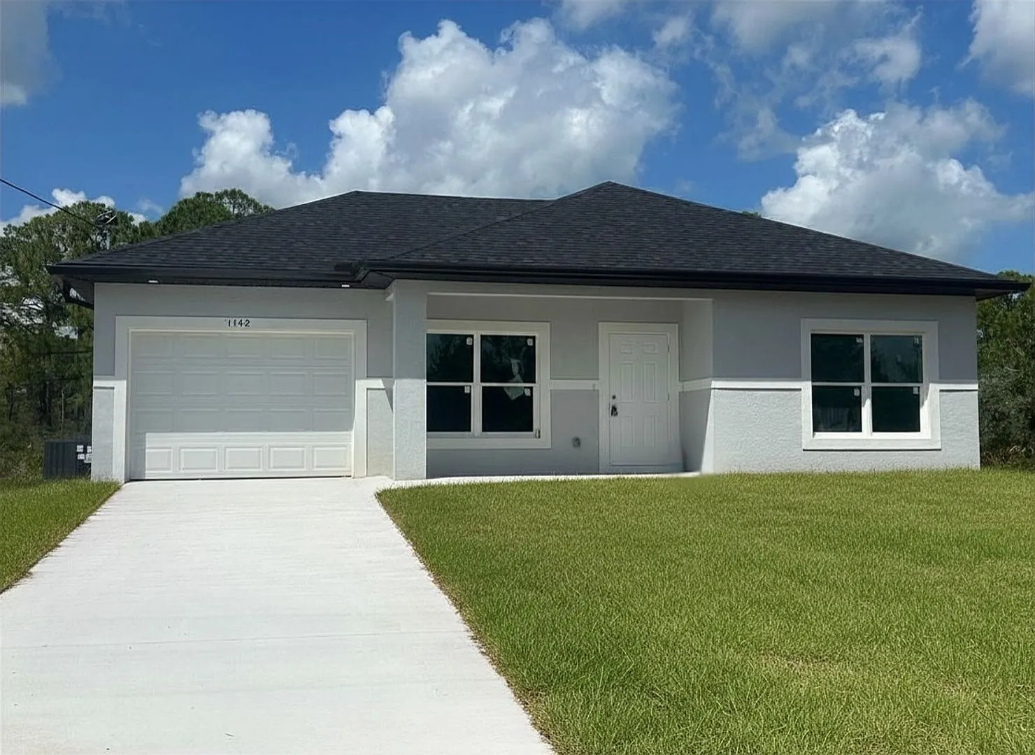 Brand-New Modern 2BR/2BA Home with Garage Quiet Lake Placid Neighborhood — Photo 1
