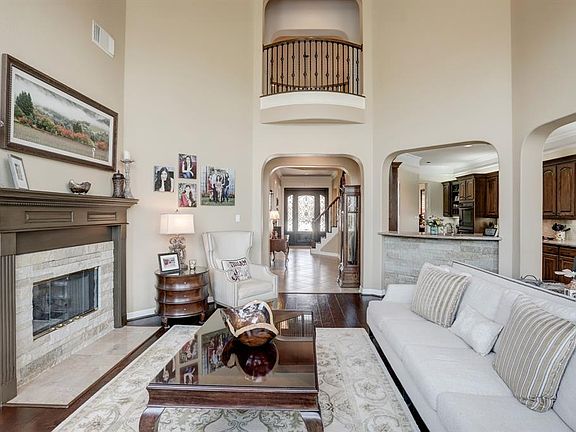 This is where you will likely spend most of your time. The family room has a soaring ceiling and is open to the kitchen and breakfast area. Juliet balconies overlook the room and the front hall.