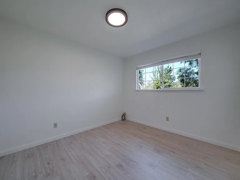 Middle bedroom. New paint, blinds, flooring, light fixtures.
