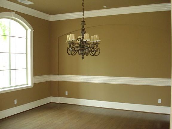 Formal dining with hardwood flooring.