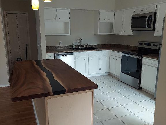 Kitchen with island and all new appliances.