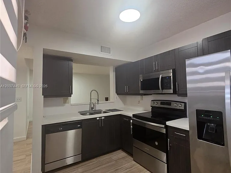 15711 SW 137th Ave #101 — Photo 1