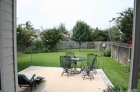 Covered Patio and patio combo. Private. True, you can't see your neighbors and they can't see you. Lush with landscaping done with top quality dillo dirt and plants, bird's paradise.