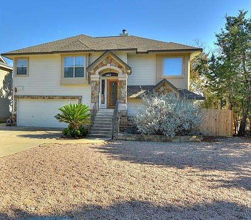 Xeriscaped and deer resistant front yard=more play & less work.
