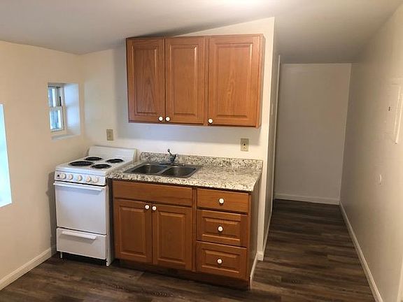 galley kitchen within living room area
