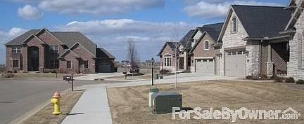 View Down the Cal-de-Sac
						:
						There is access to the park, ponds and walking trail at the end of the street.