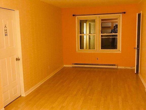 LIving room from kitchen, and showing bedroom #2 door.