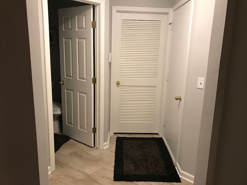 Stepping from the garage , you'll find a large laundry/storage room , large coat closet, powder room, family room and library