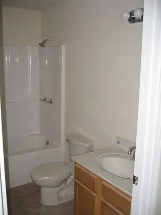 Bathroom sink, shower/tub, and toilet