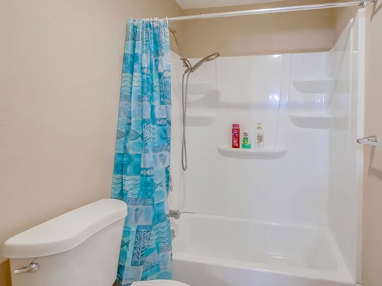 Freshen up in our tub & shower combo, complete w/ bathroom essentials