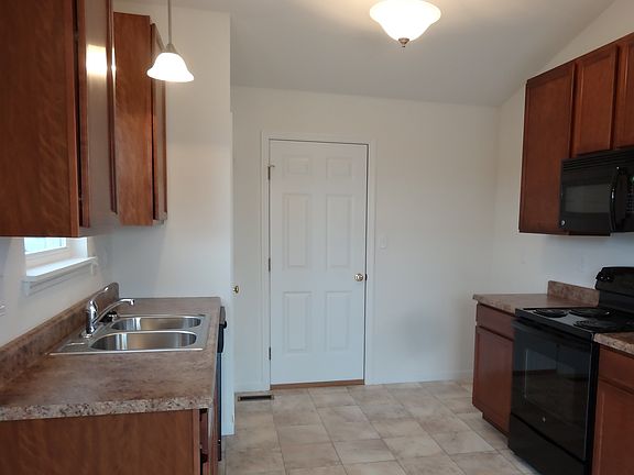 New kitchen with new side by side refrigerator freezer