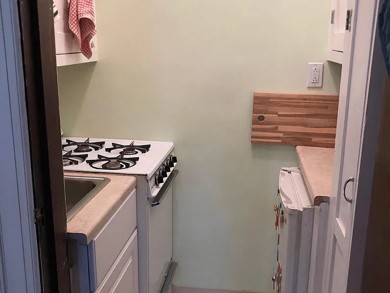 Kitchen, lots of storage on both sides of kitchen