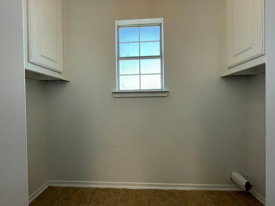 Laundry Room - Washer on left side; Dryer goes right side. Cabinets at both sides