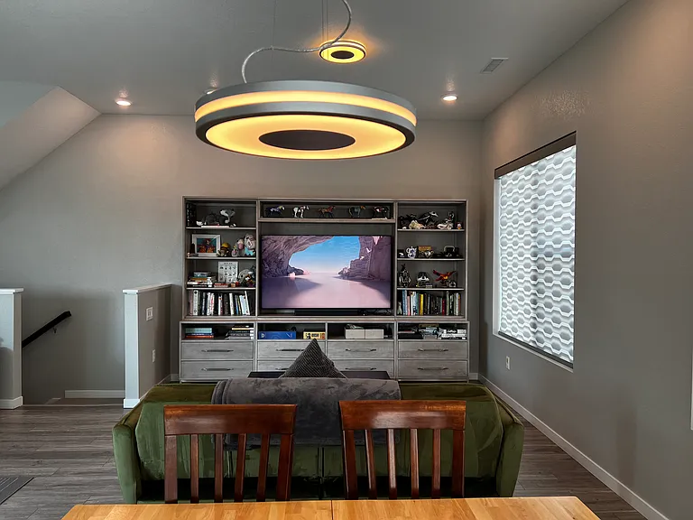 Entry to 2nd floor area. Hunter Douglass power operated window shades, can be controlled and scheduled in the app.
