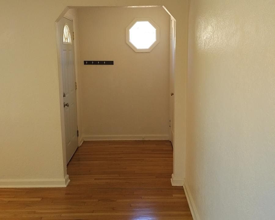 Entry way and front room, wood floors in living spaces