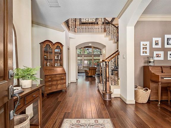 Walk in and feel the warmth of this home! Upon entry you are greeted by beautiful hardwood floors flowing through all main areas. The entry is flanked