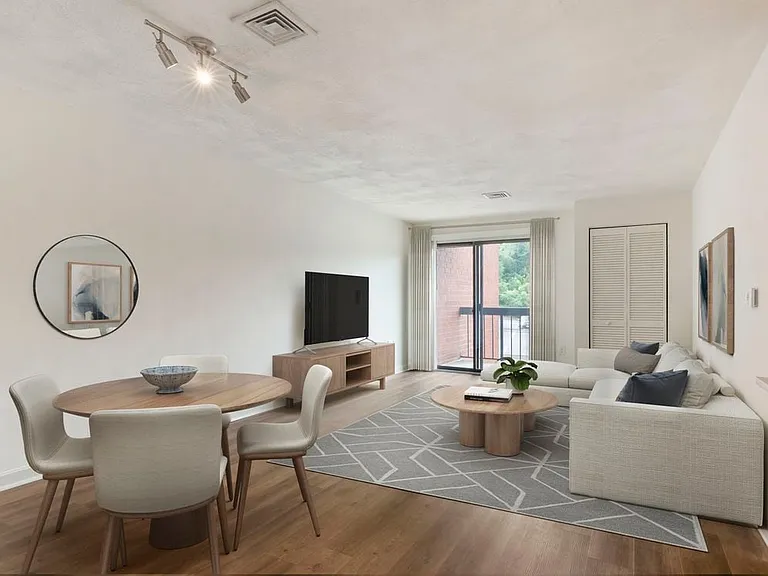Renovated Package I dining and living room with hard surface flooring